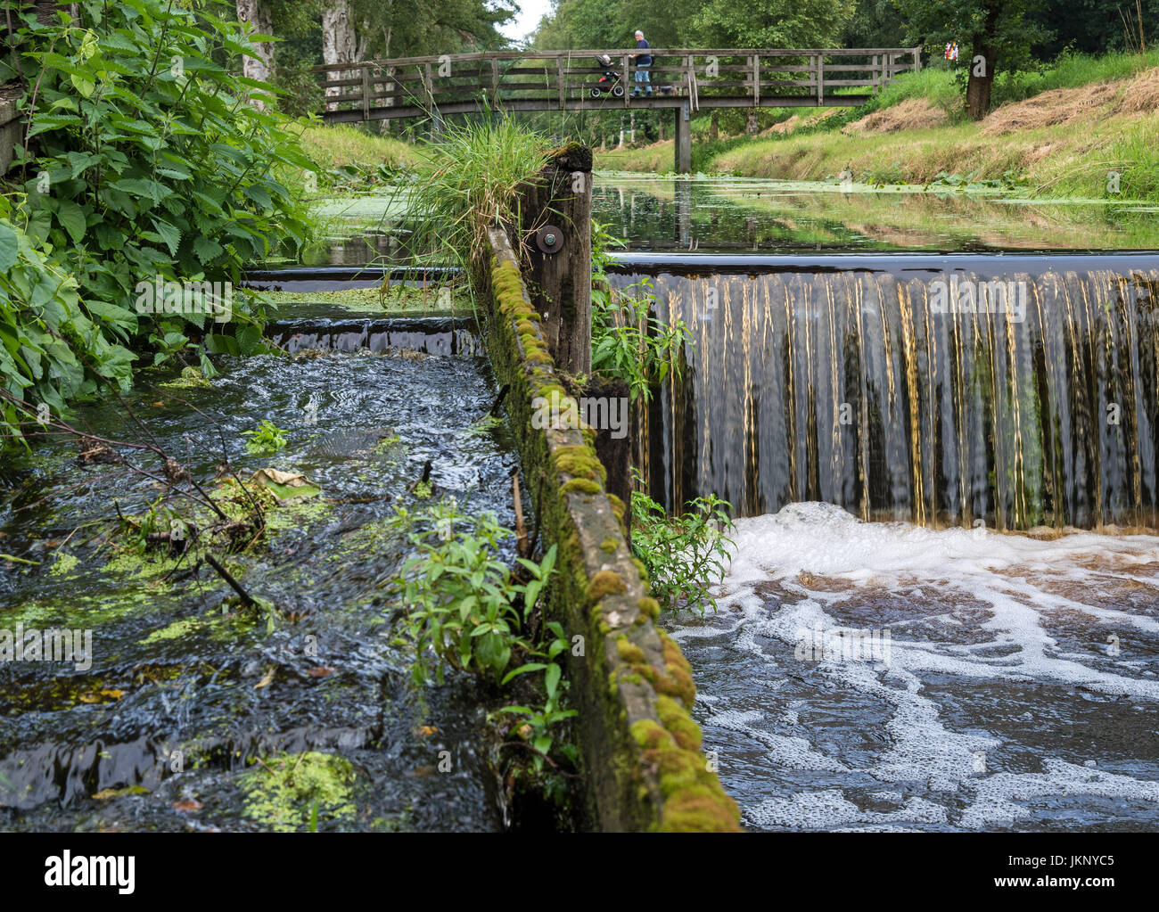 A side arm of the Oste-Hamme-Kanal, with a fish ladder on the left, near Findorf, Germany, 24 July 2017. Photo: Ingo Wagner/dpa Stock Photo