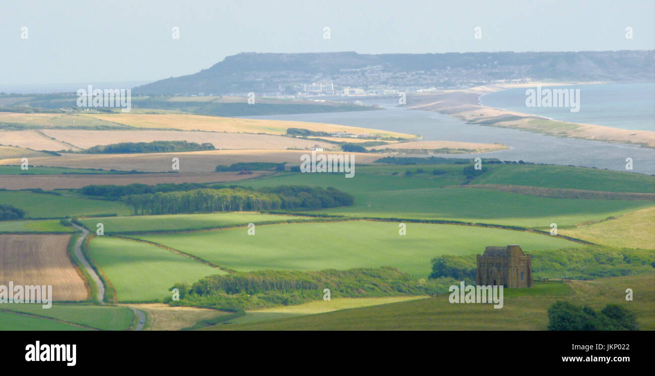 Portland, Dorset. 24th July, 2017. Chesil Beach and the Isle of Portland in the warm afternoon sunshine, seen from the B3157 coast road Credit: stuart fretwell/Alamy Live News Stock Photo