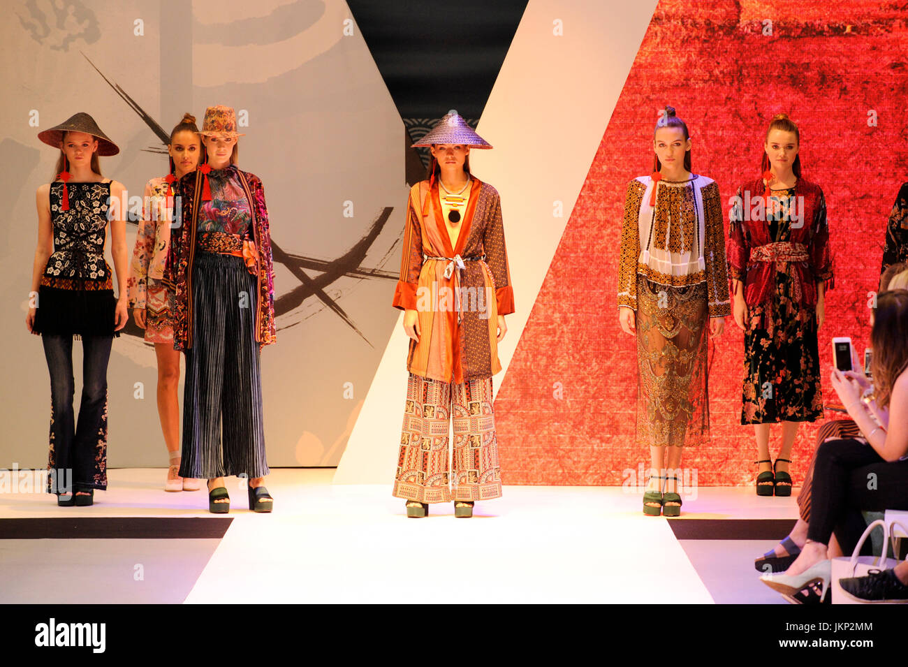 Models on the Oriental-themed Main Catwalk at Pure London, Olympia, London, UK. Pure London, the UK's leading trade fashion exhibition opens its doors 23-25th July 2017, featuring two halls of trade stands from leading fashion and accessories designers, lectures from industry experts, and fashion shows on two different catwalks throughout each day. Fashion buyers were out in force to see the new season's collections. 24th July 2017. Credit: Antony Nettle/Alamy Live News Stock Photo