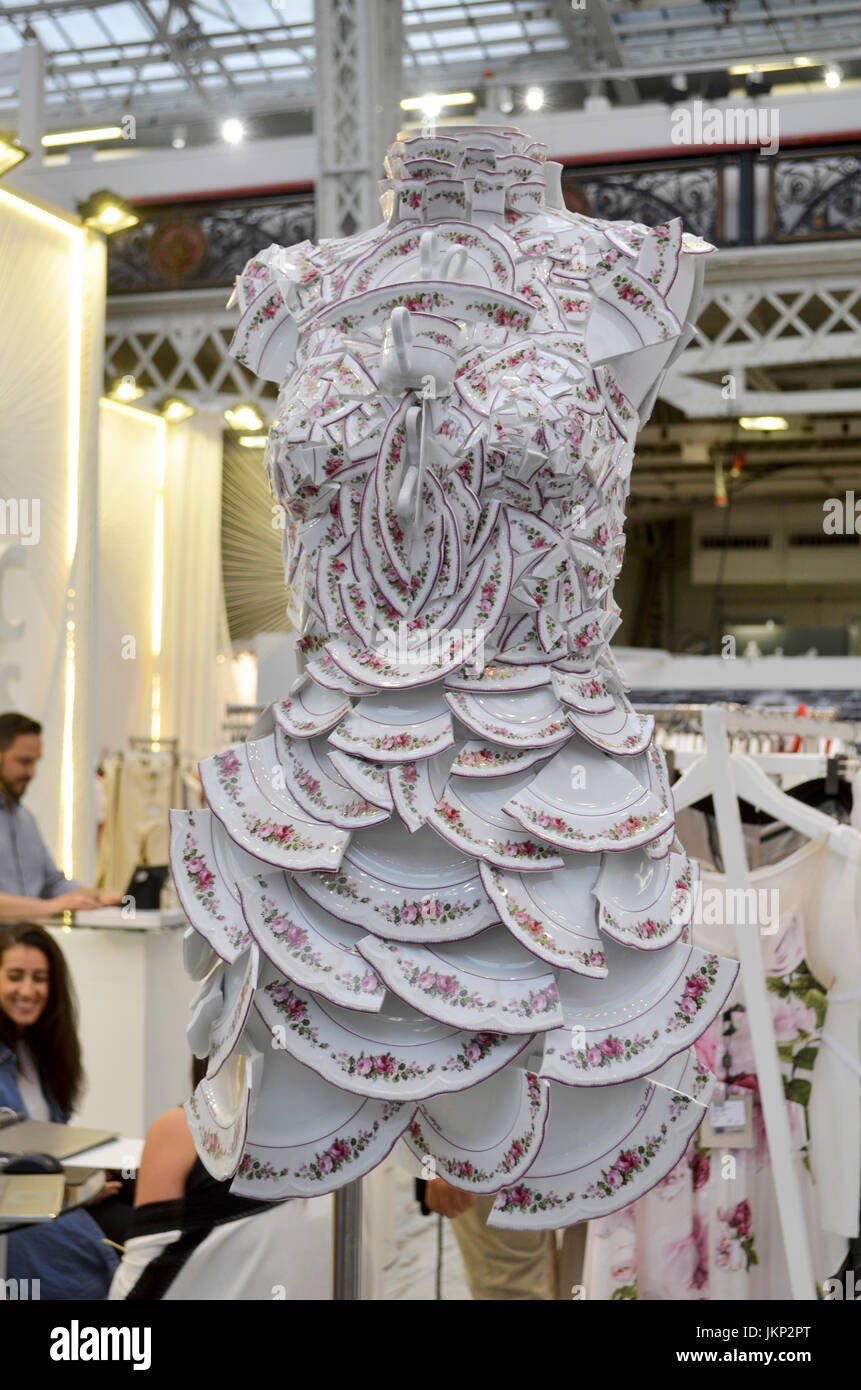 Broken plate dress on display at Pure London, Olympia, London, UK. Pure London, the UK's leading trade fashion exhibition opens its doors 23-25th July 2017, featuring two halls of trade stands from leading fashion and accessories designers, lectures from industry experts, and fashion shows on two different catwalks throughout each day. Fashion buyers were out in force to see the new season's collections. 24th July 2017. Credit: Antony Nettle/Alamy Live News Stock Photo
