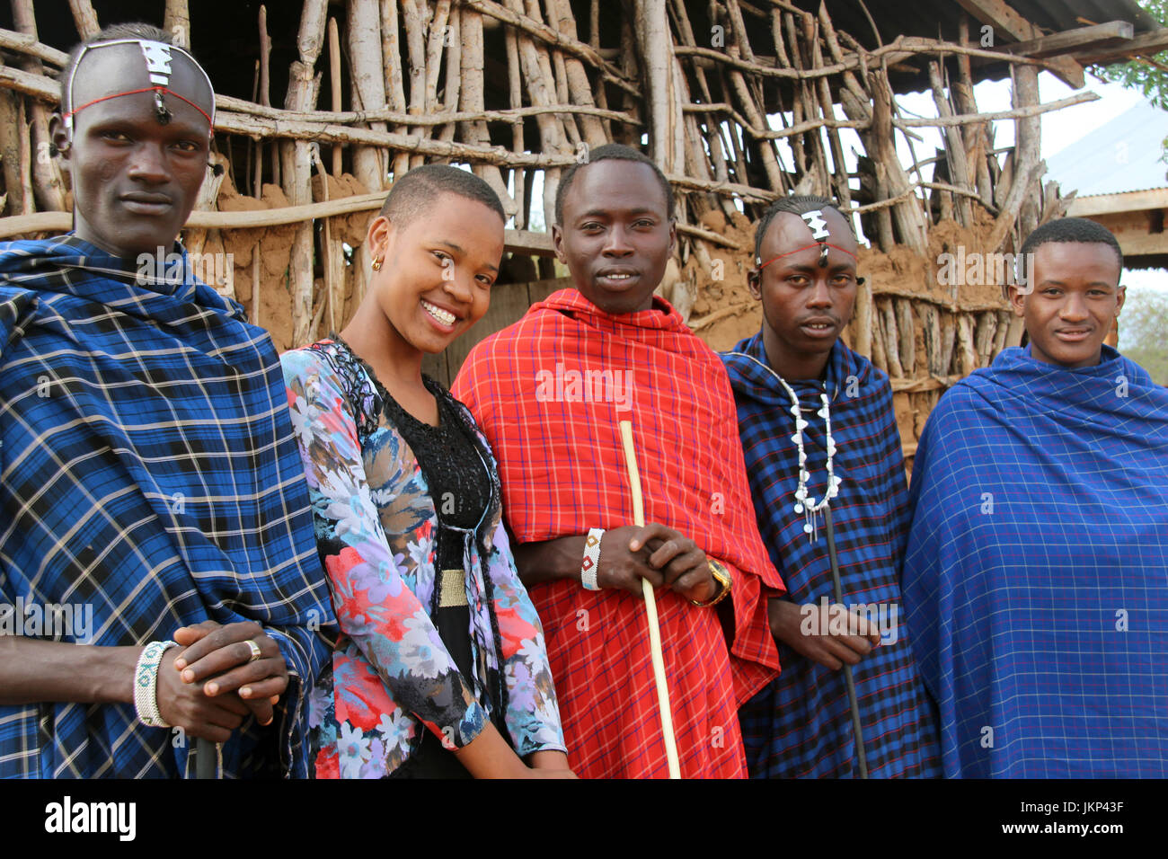 The 19 year old Ester (2-L) poses with traditionally dressed people in her native village of Majengo, near Arusha, Tanzania, 18 Juli 2017. Hundred-thousands of Germany have claimed sponsorship for a child in poorer countries. Unnoticed by the general public, these sponsorships have helped many children onto the road of success - Ester from Tanzania is only one example. Photo: Jürgen Bätz/dpa Stock Photo