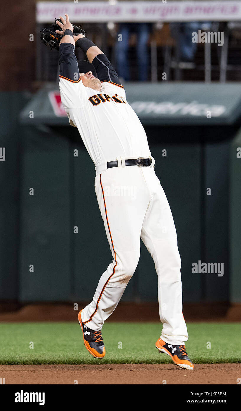 San Francisco, California, USA. 24th July, 2017. San Francisco Giants second baseman Joe Panik (12) nearly falling backwards to catch a high pop up, to end the top of the eighth inning, during a MLB game between the Pittsburgh Pirates and the San Francisco Giants at AT&T Park in San Francisco, California. Valerie Shoaps/CSM/Alamy Live News Stock Photo