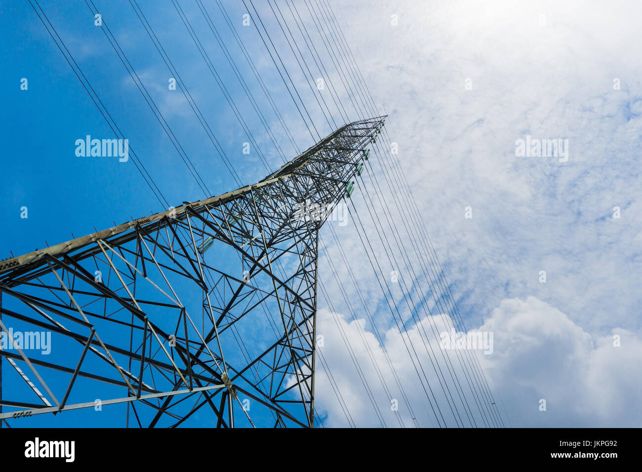 high voltage pole blue sky background Stock Photo - Alamy
