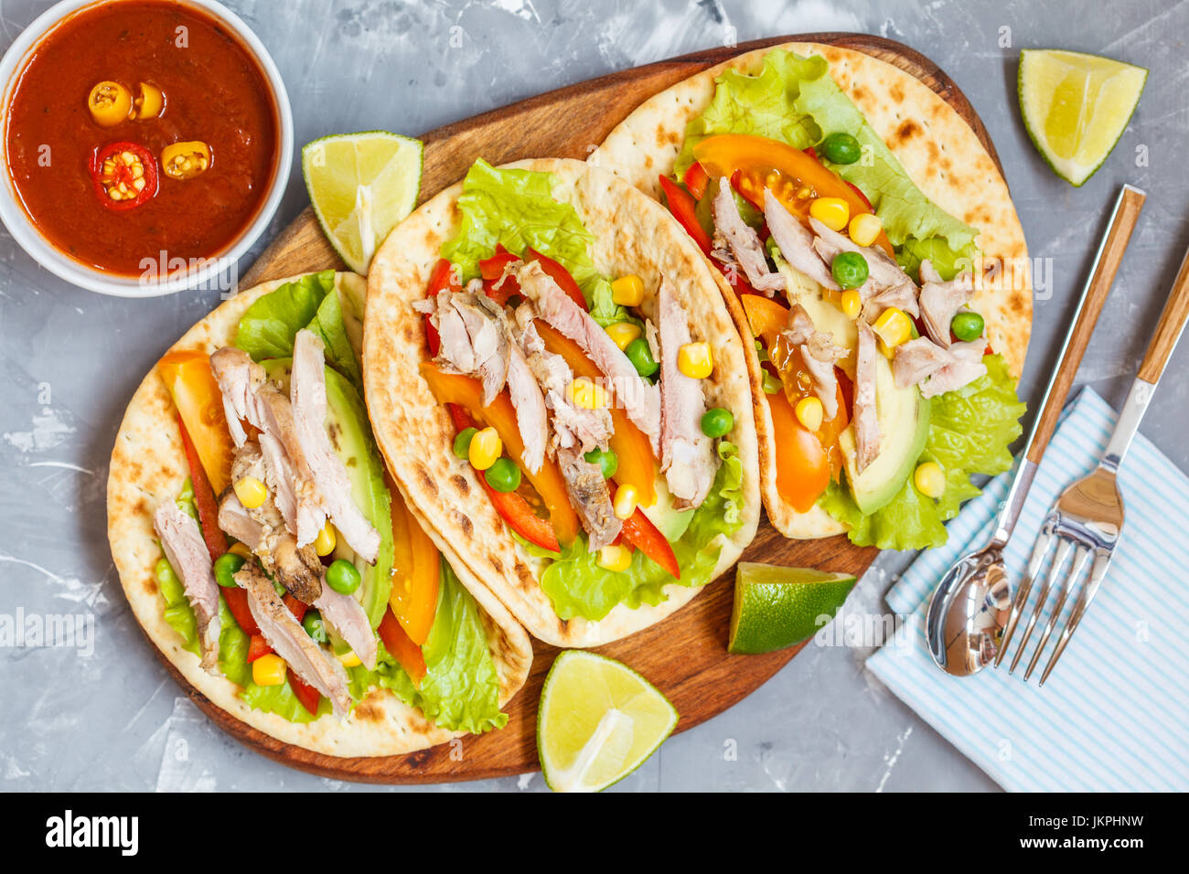 Fajitas with chicken, vegetables and spicy sauce salsa. Stock Photo