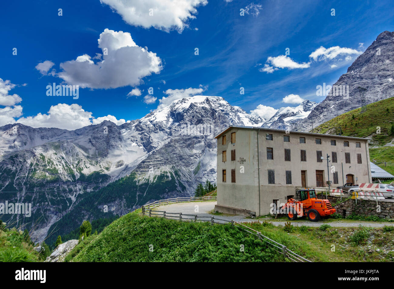 Stelvio refuge and snow over the mountains Stock Photo