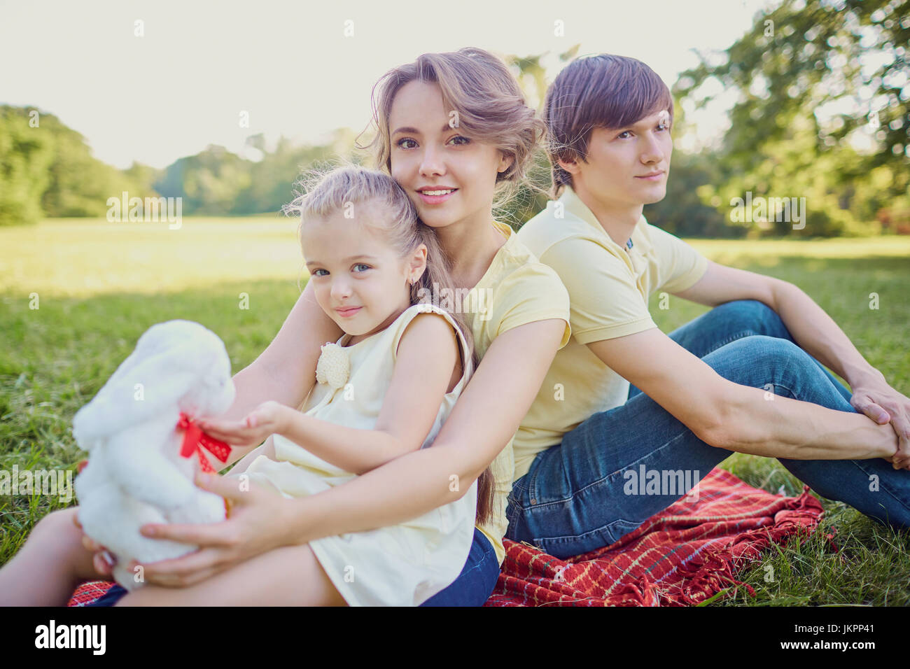 Happy family playing in the park Stock Photo - Alamy
