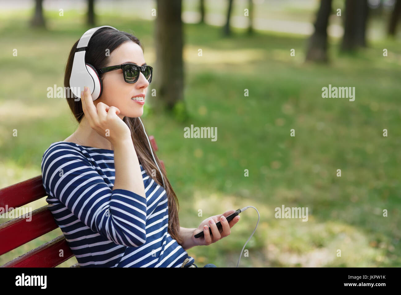 woman in headphones outdoors Stock Photo