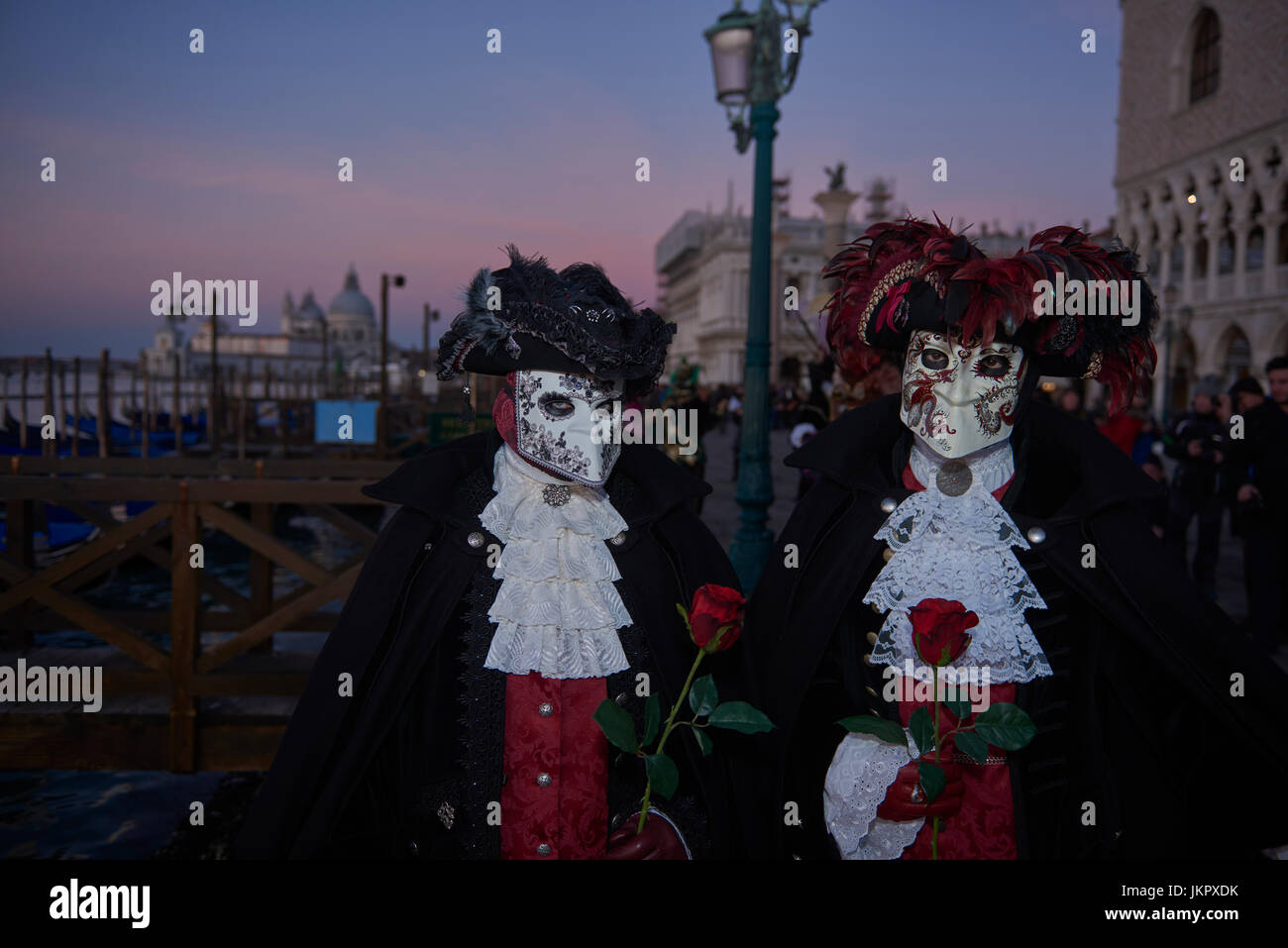 male and female Baute Mask wearers in the Carnival of Venice, Italy Stock Photo