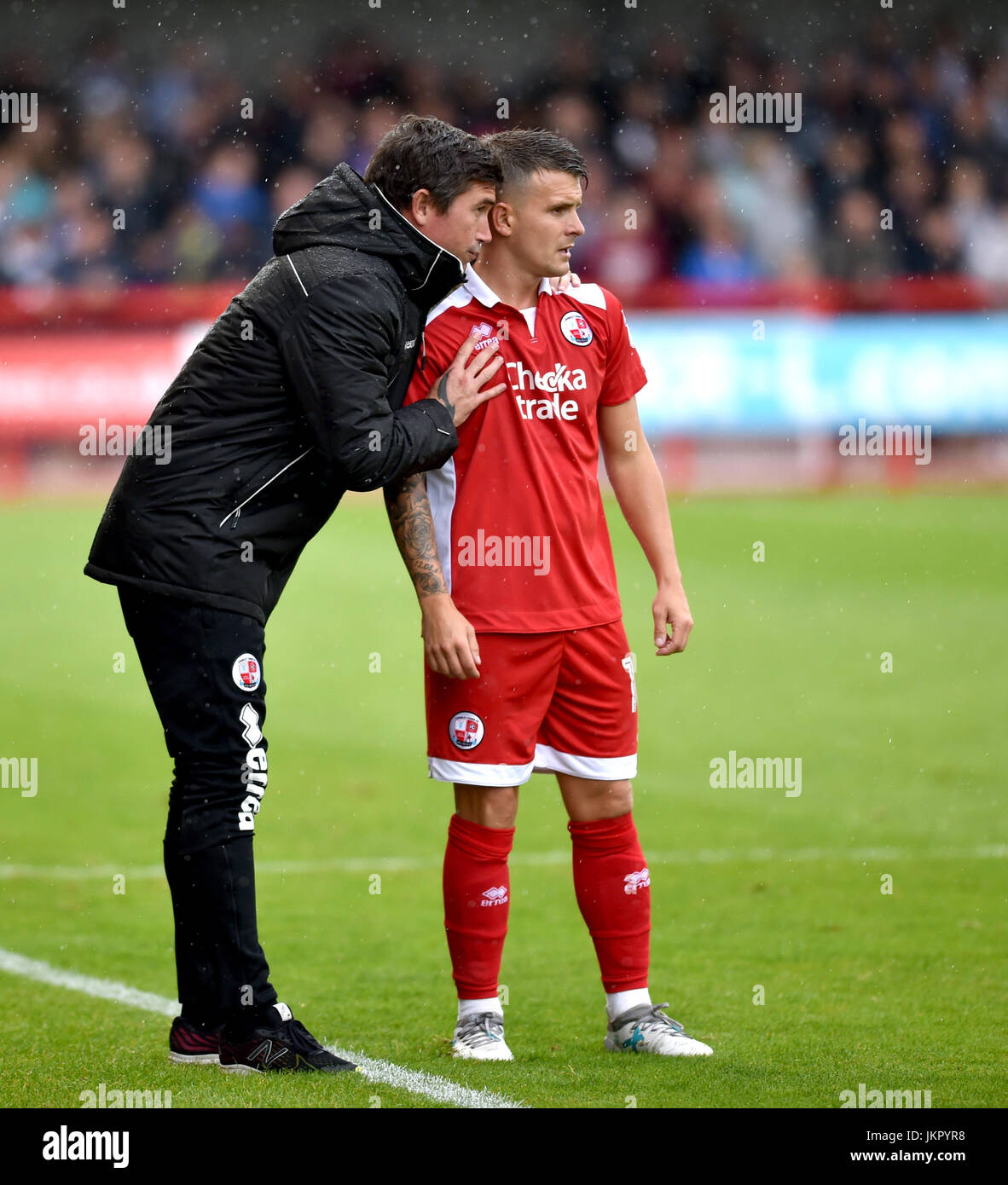 Crawley head coach Harry Kewell with player Dean Coxduring the pre season Friendly match between Crawley Town and Brighton and Hove Albion at the Checkatrade Stadium in Crawley. 22 Jul 2017 -Editorial Use Only Stock Photo