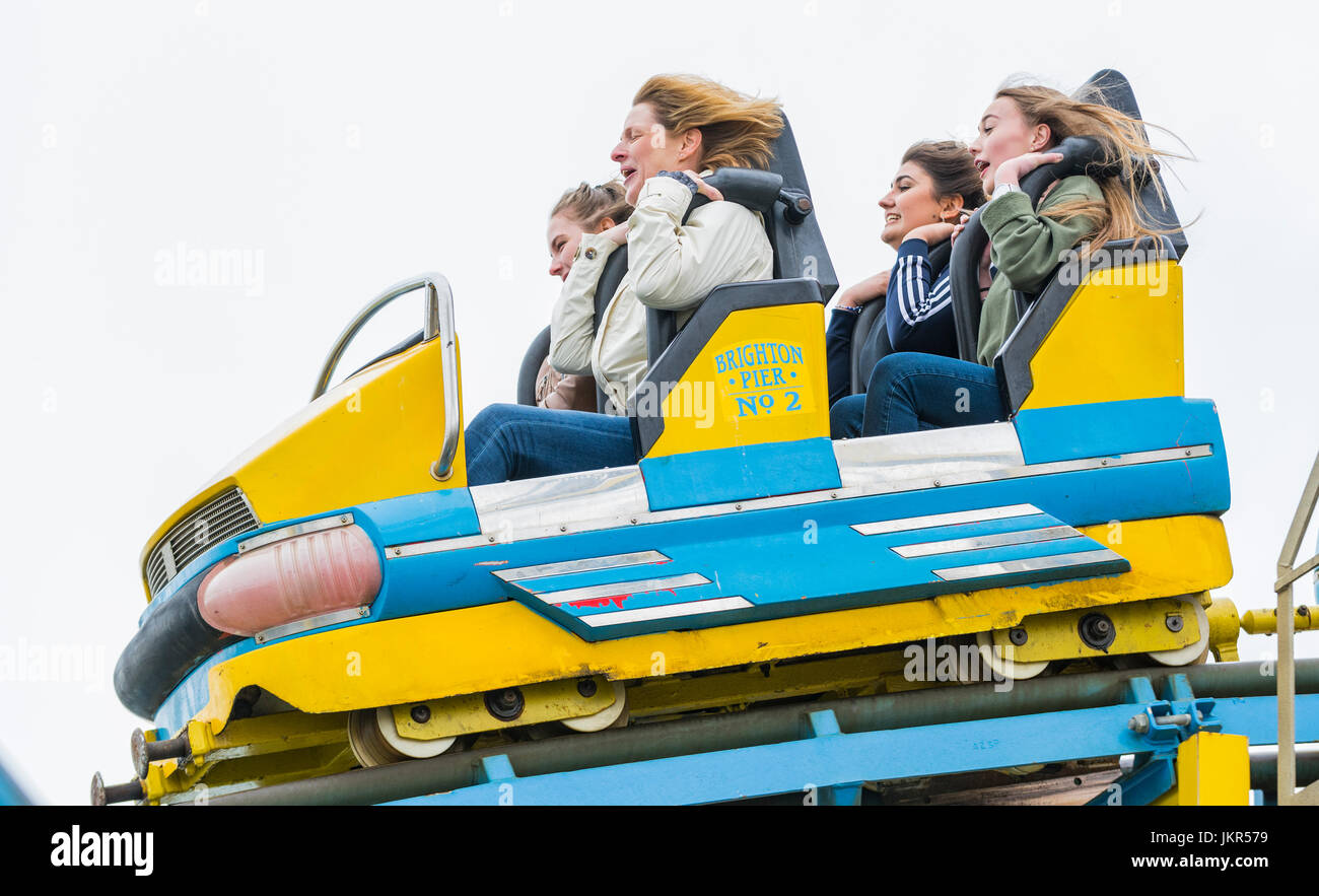 Roller Coaster car with people having fun. Stock Photo