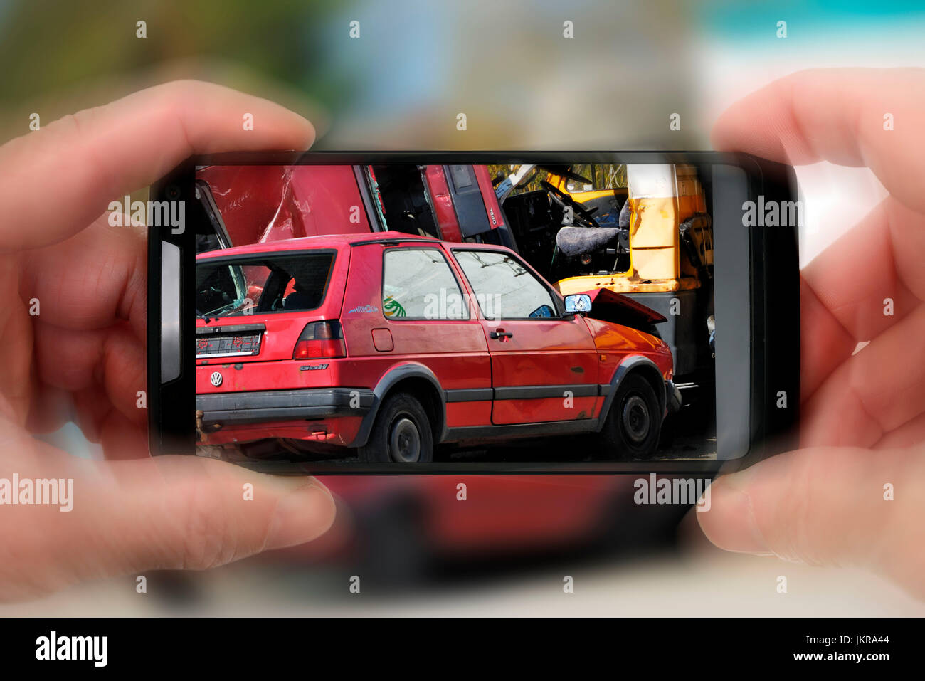 Onlooker takes a photo of traffic accident, of symbolic photo, Schaulustiger fotografiert Verkehrsunfall, Symbolfoto Stock Photo