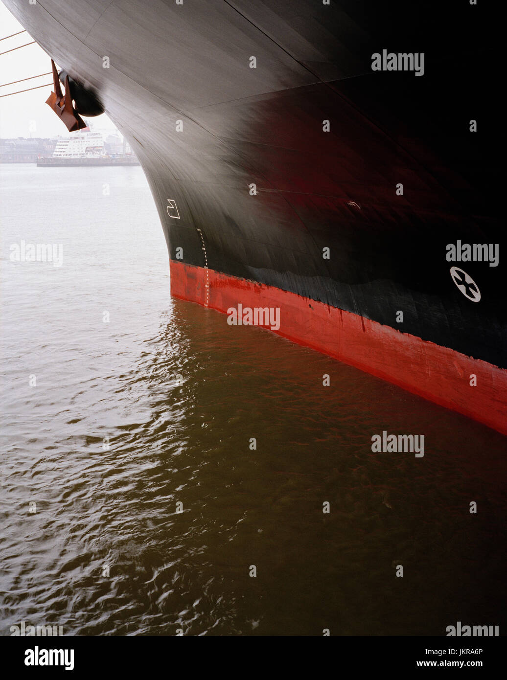 Cropped image of black ship moored on sea Stock Photo