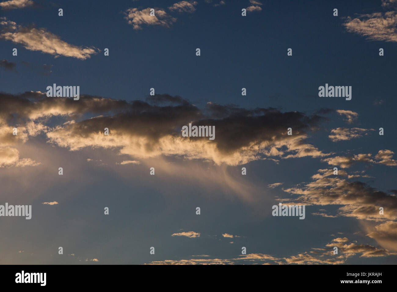 Low angle view of clouds in blue sky Stock Photo - Alamy
