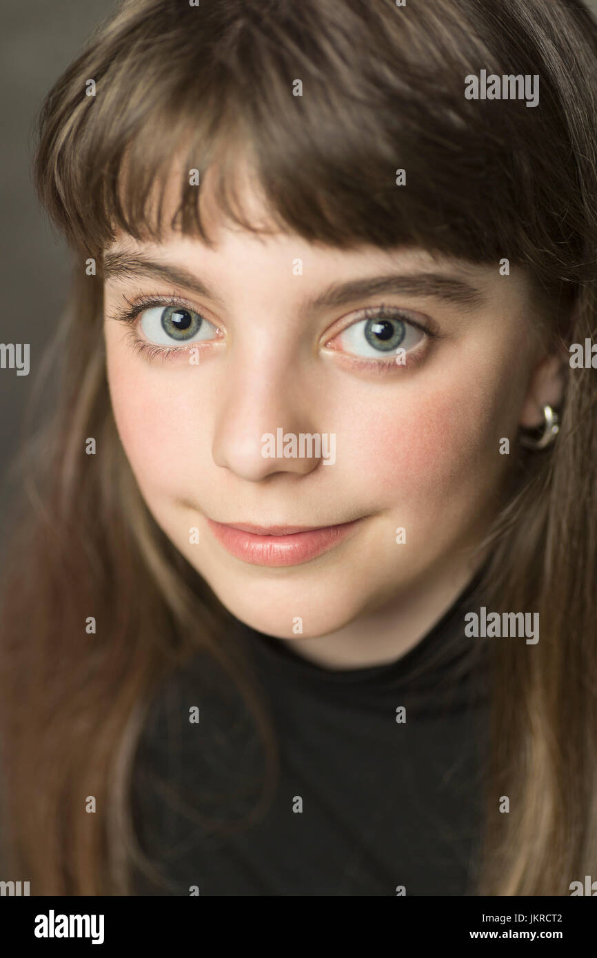 Close-up portrait of smiling girl with long brown hair Stock Photo - Alamy