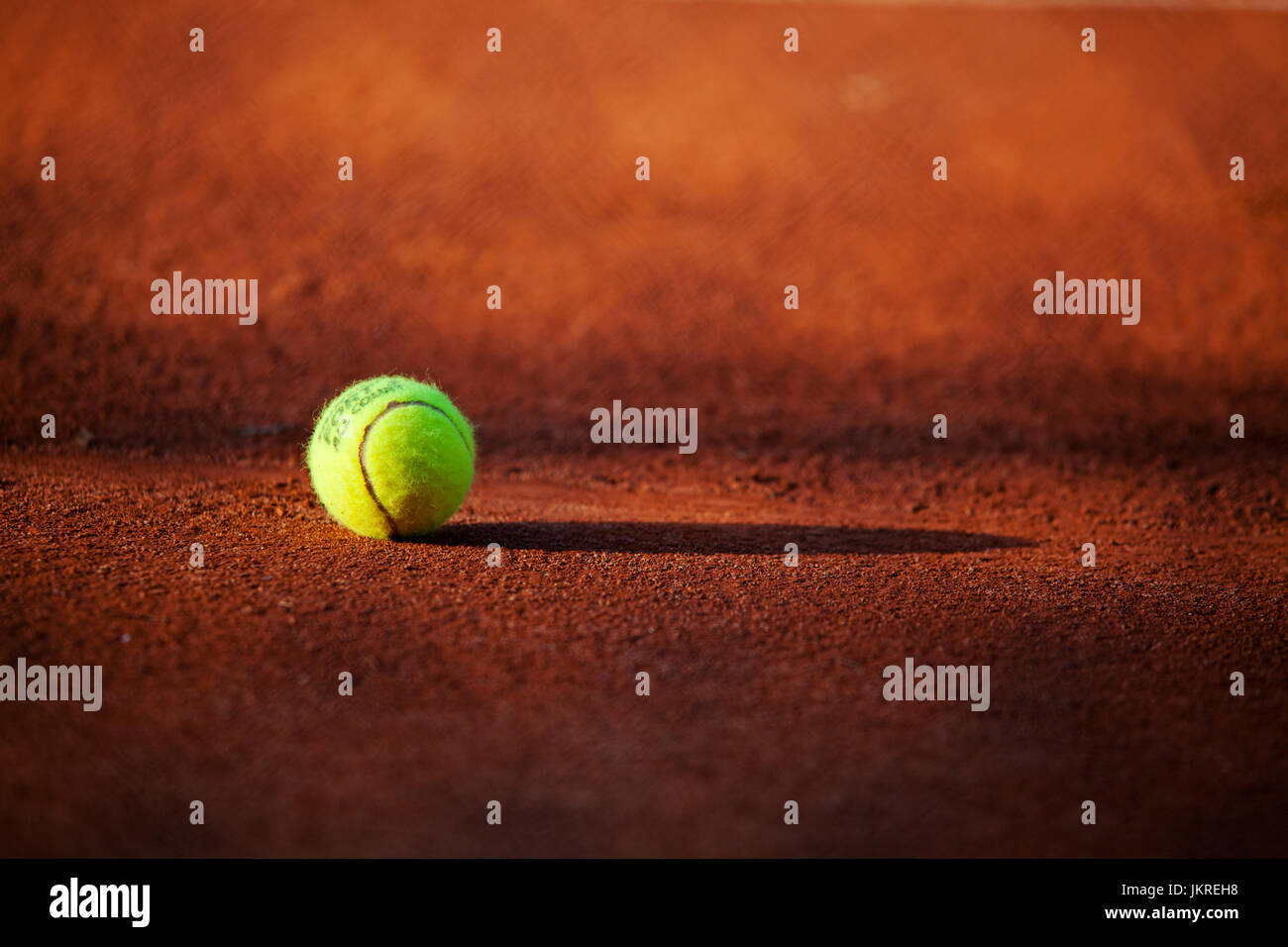 tennis ball on clay court Stock Photo