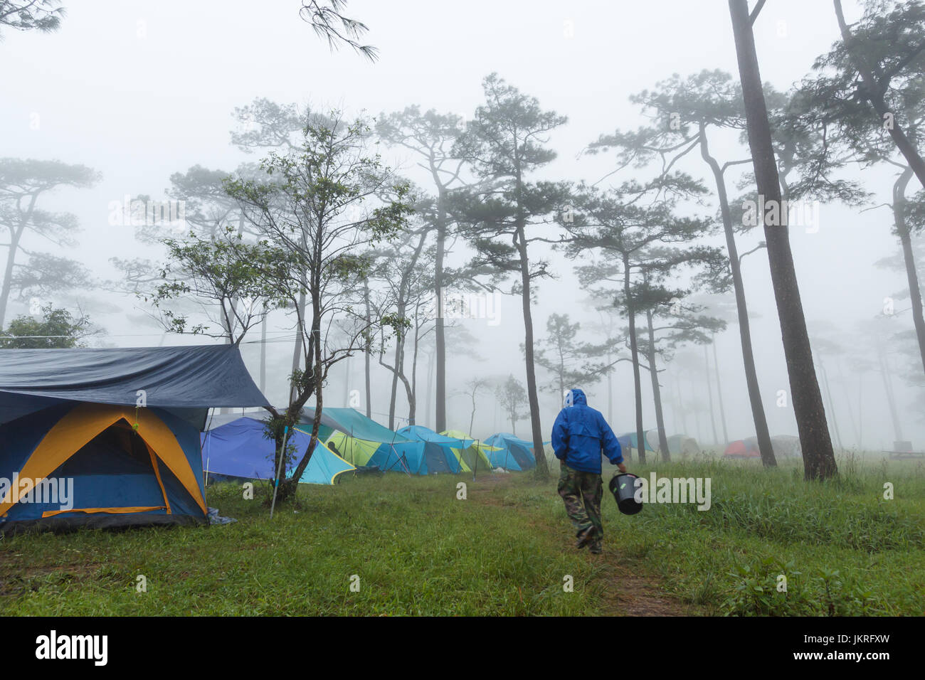 Someone carry bucket for pick up water Stock Photo Alamy
