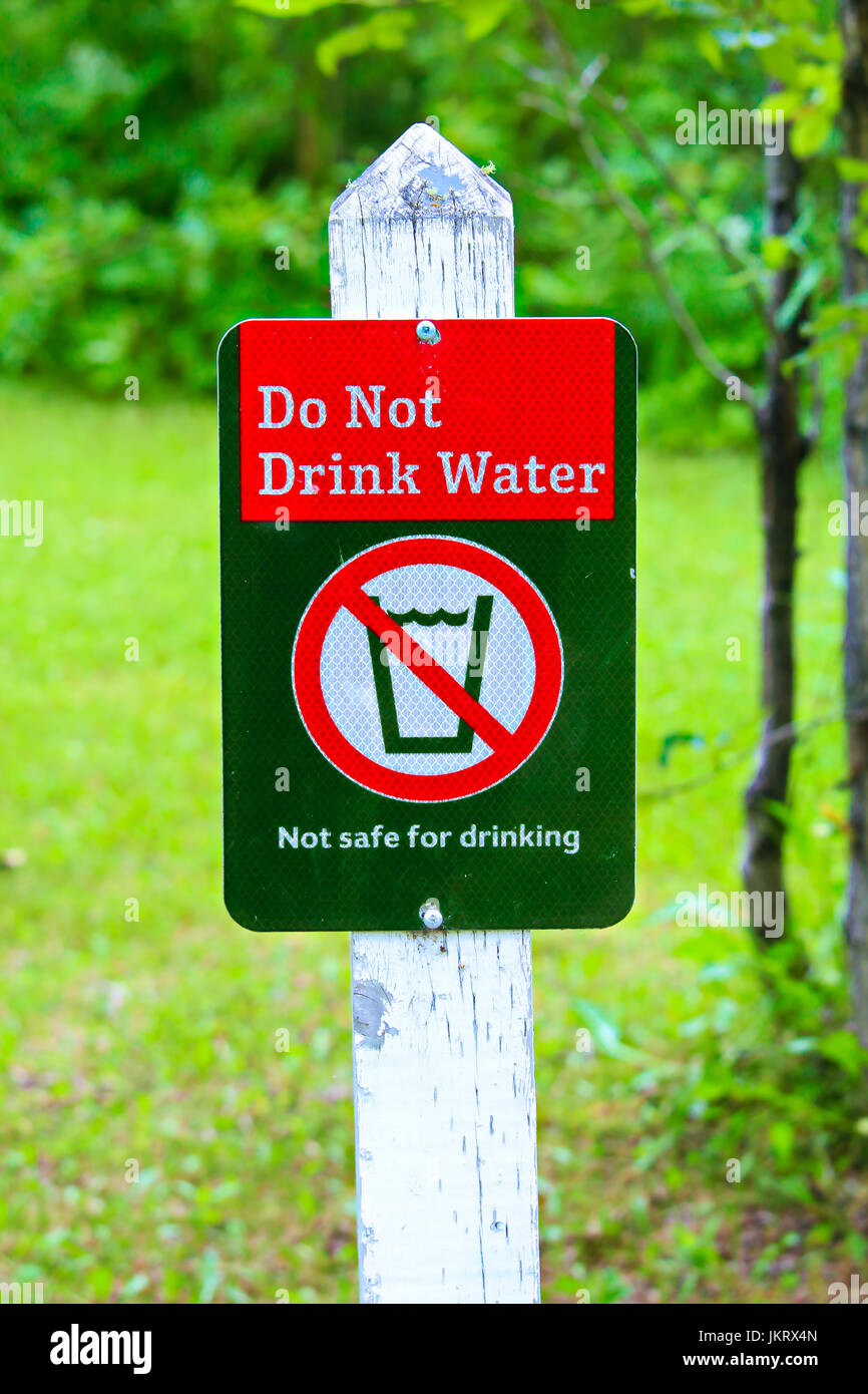 A do not drink water sign with a green background. Stock Photo