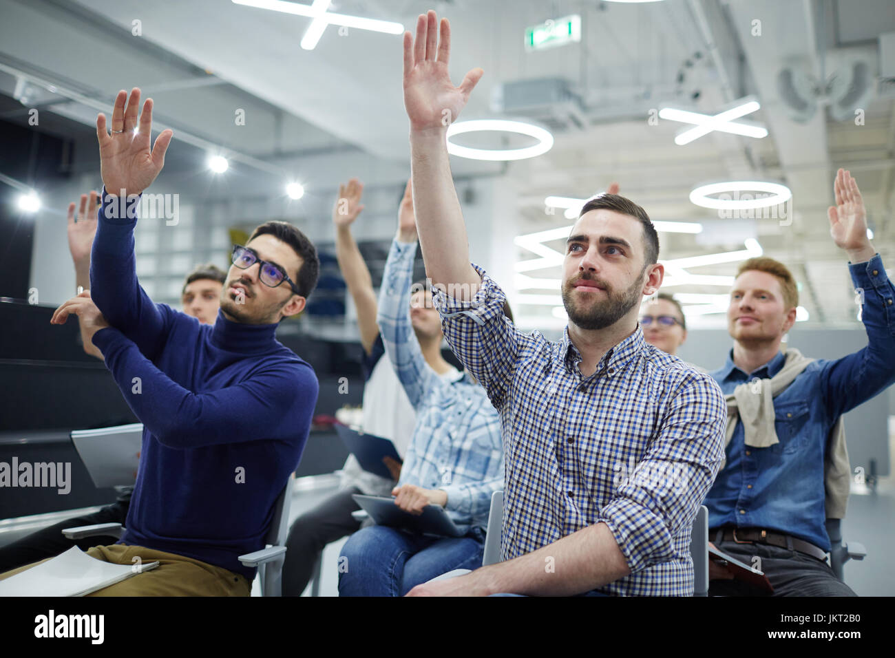 Business people voicing ideas at lesson Stock Photo