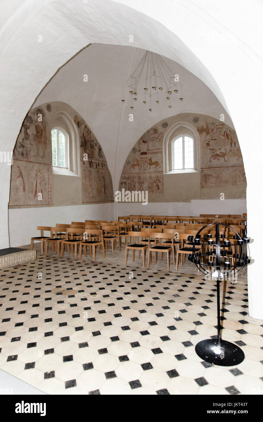 Danish medieval religious frescos from the 14th century in the Romanesque style Oerslev Church depicting diffrenet scenes including the famous dancing Stock Photo