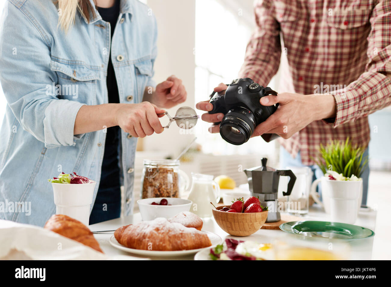 Food-photographer and food-stylist producing food advert Stock Photo