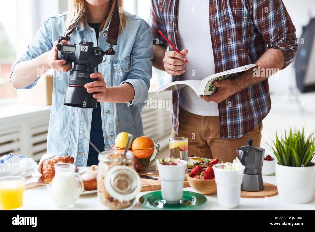 Professional photographer shooting food for advert Stock Photo
