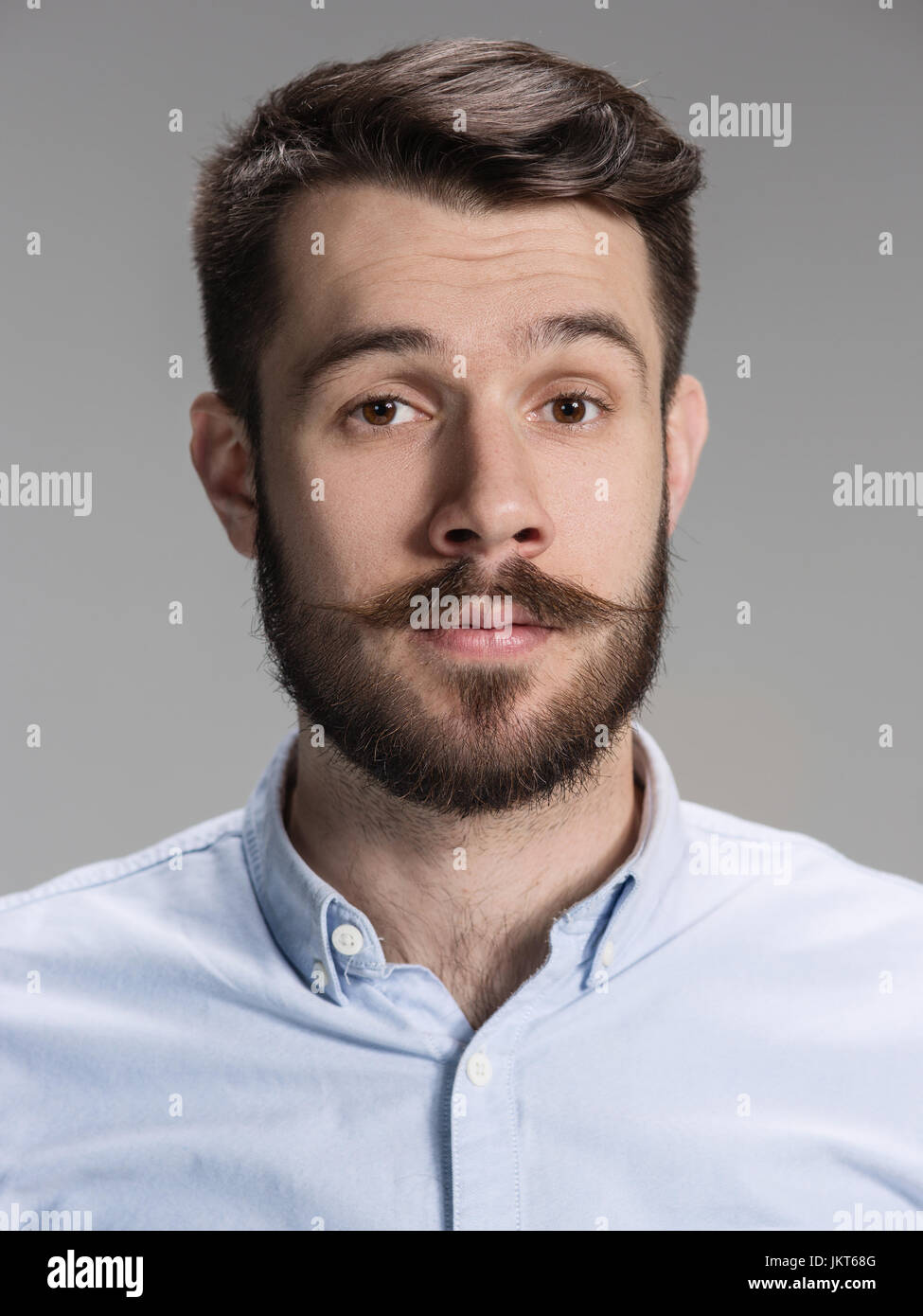 The young man looking at camera Stock Photo - Alamy