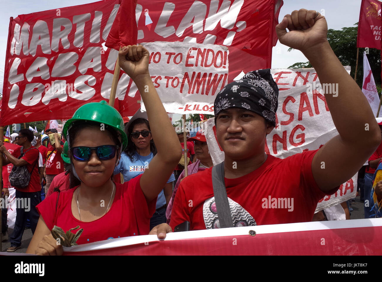 Philippines. 24th July, 2017. Protesters raise clenched fists during a ...