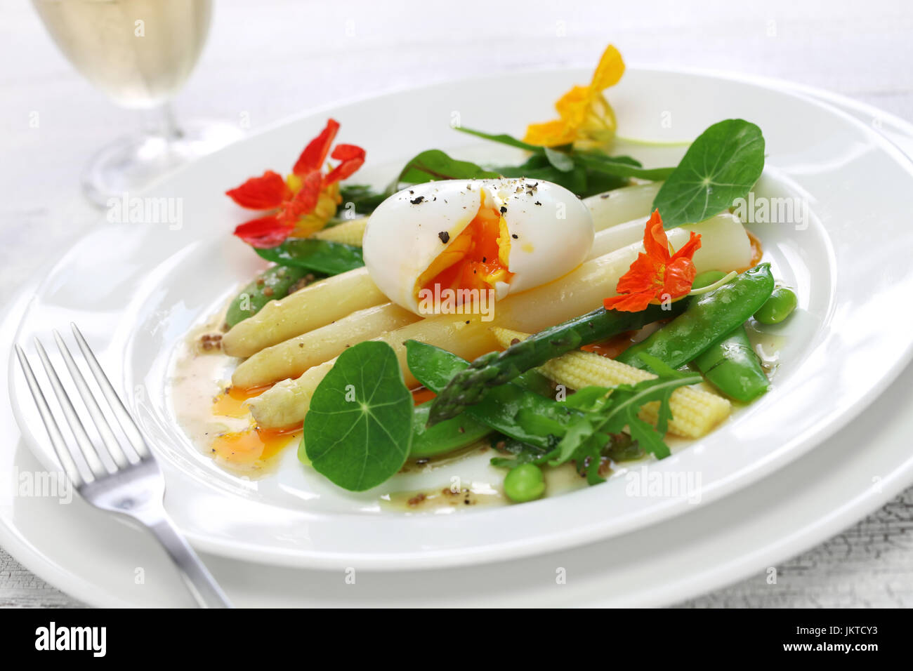 white asparagus warm salad with soft boiled egg and vegetables Stock