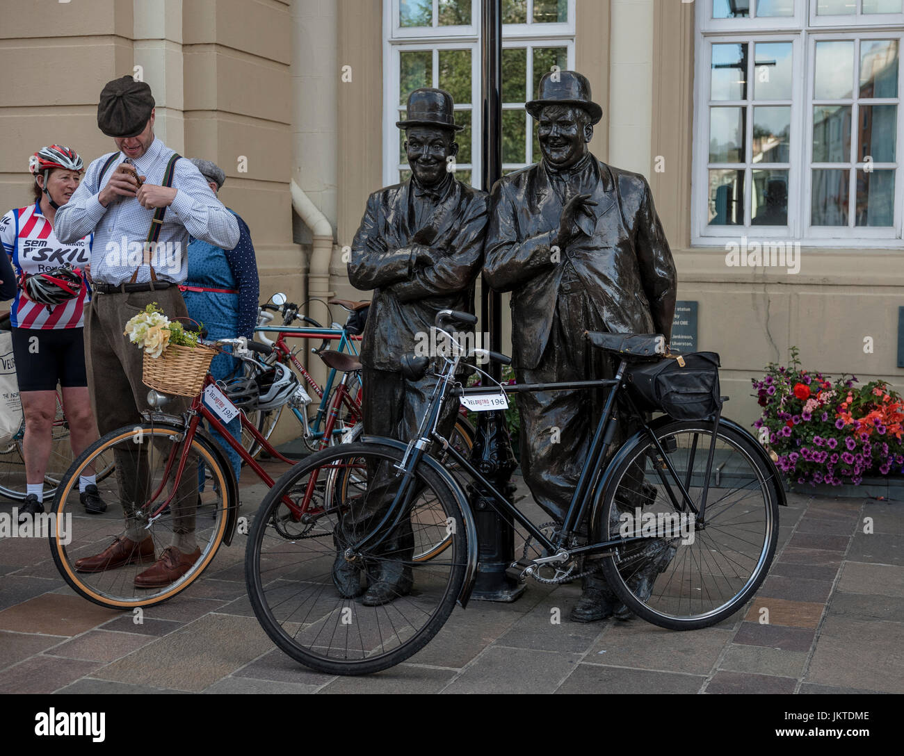 Bronze statue of Laurel and Hardy during a vintage cycling event in Ulverston, Cumbria Stock Photo