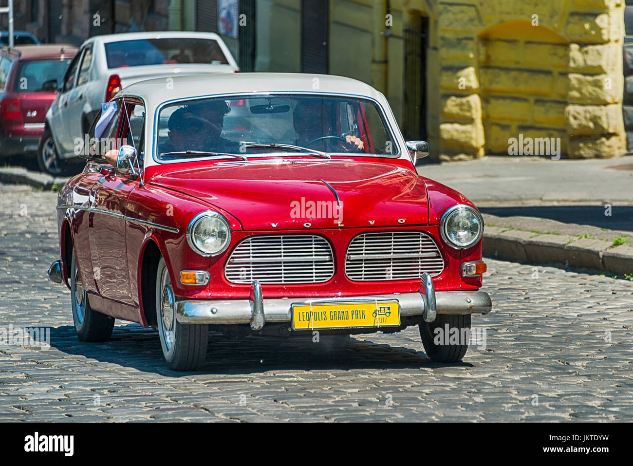Lviv, Ukraine - June 4, 2017: Old retro car VOLVO AMAZON 121 with its owner and au unknown passengers taking participation in race Leopolis grand prix Stock Photo