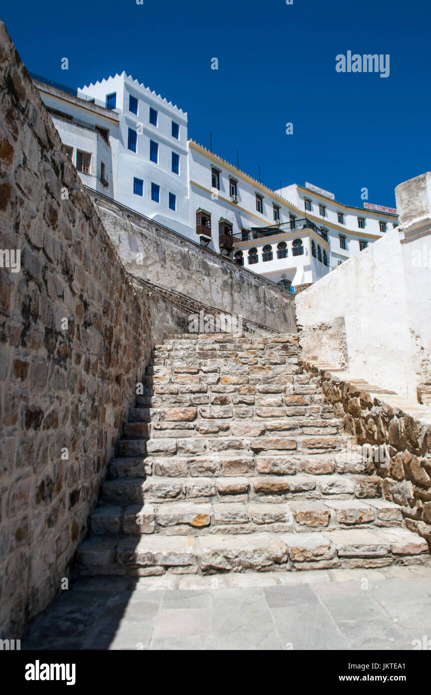 North Africa, Morocco: the stairs of the wall of the Old City and the white houses of Tangier, the african city on the Maghreb coast Stock Photo