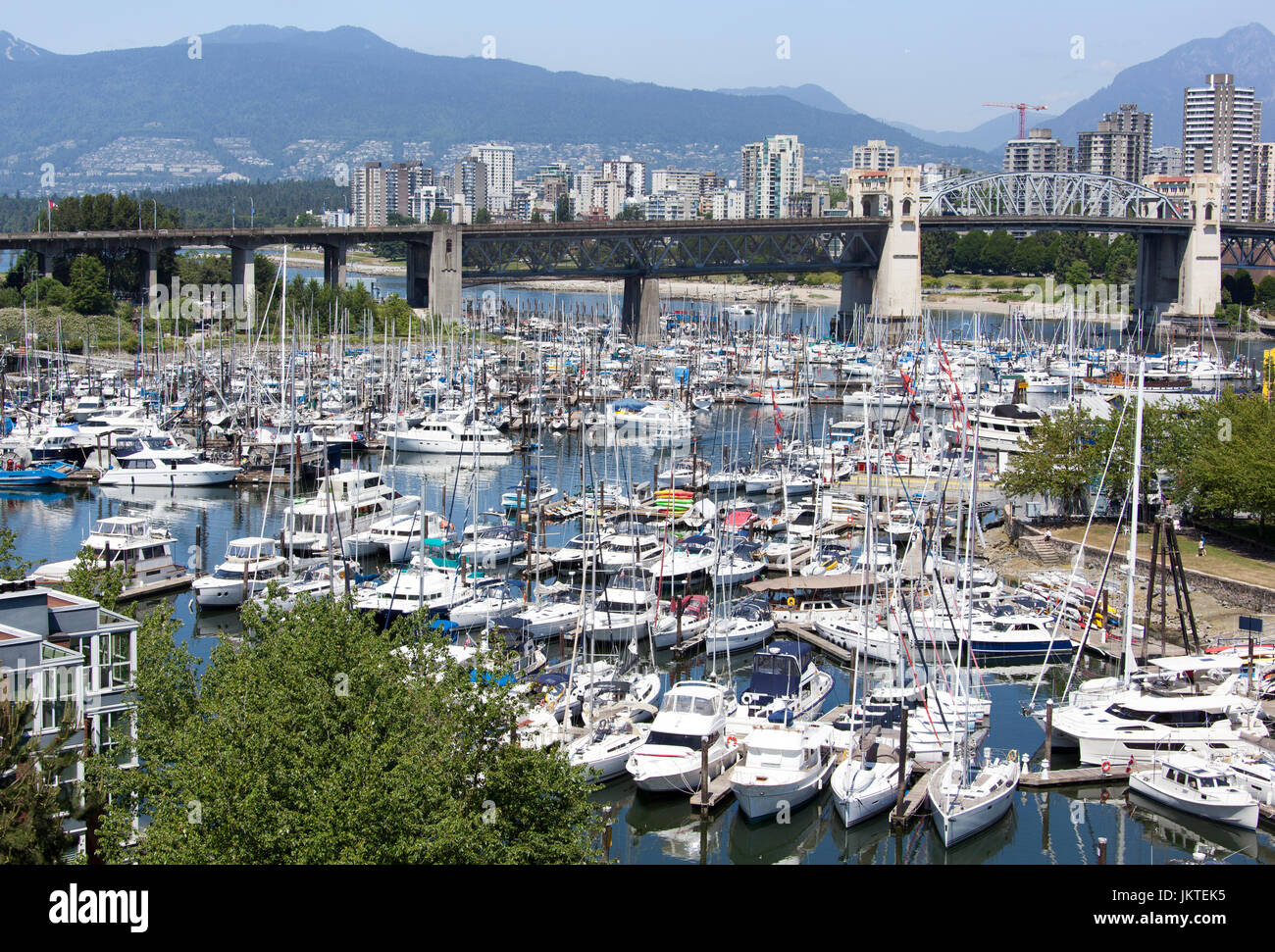 The marina view with Burrard Bridge over False Creek and Vancouver ...