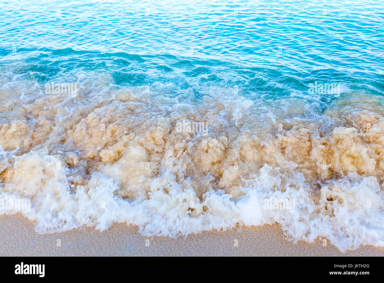 Caribbean beach, transparent blue water and clean sandy shore. Stock Photo