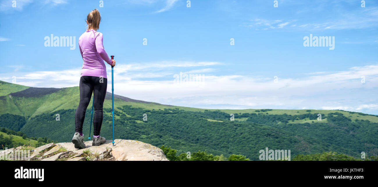 Young woman hiking in the mountains Stock Photo - Alamy