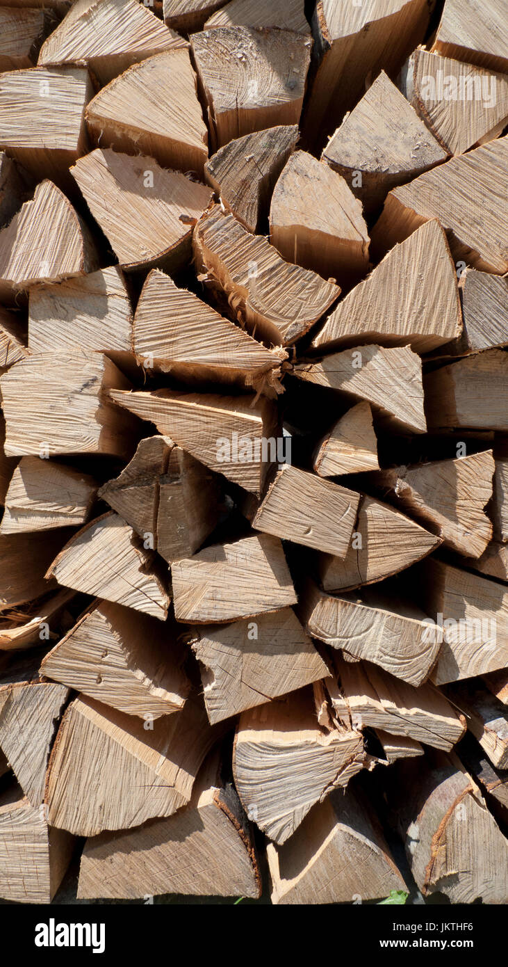 Cut logs, stacked Stock Photo - Alamy