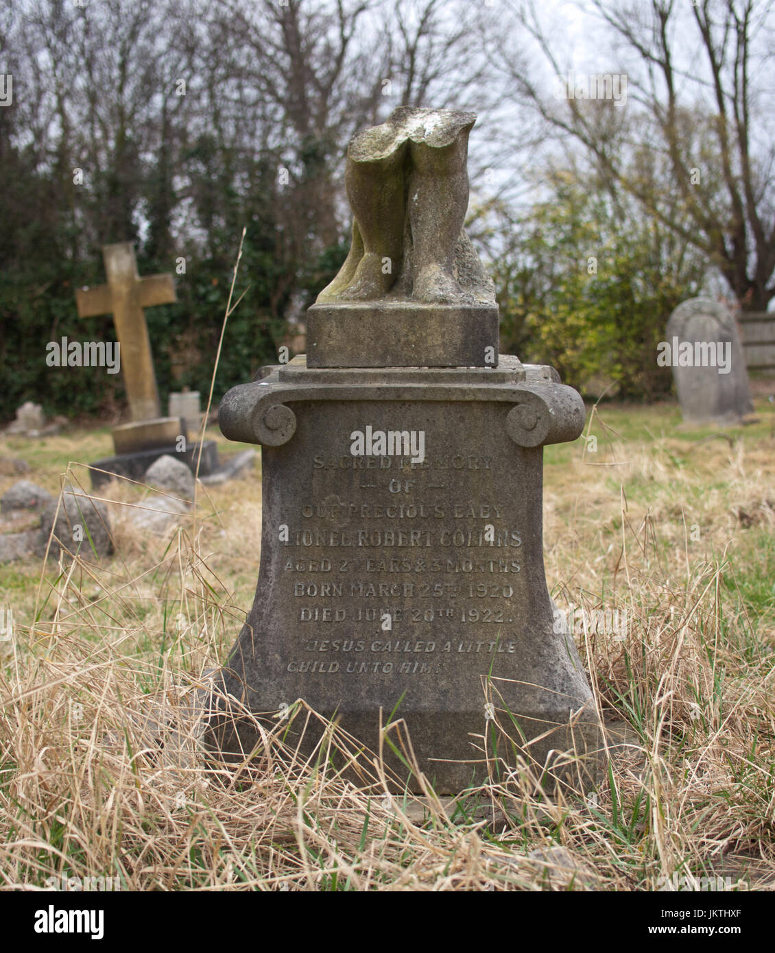 Broken tombstone Stock Photo