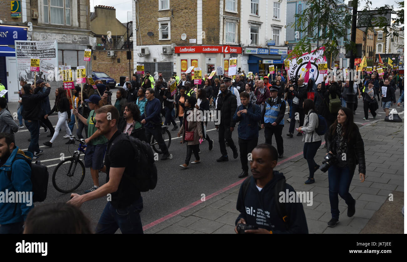 Members from Hackey Stand Up To Racism protest outside a Yours Locally shop in Kingsland Road, east London, as the police watchdog launched an investigation after young black man Rashan Charles died in the shop after being chased by police. Stock Photo