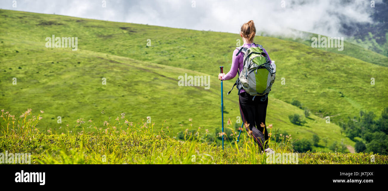 Young woman hiking in the mountains Stock Photo - Alamy