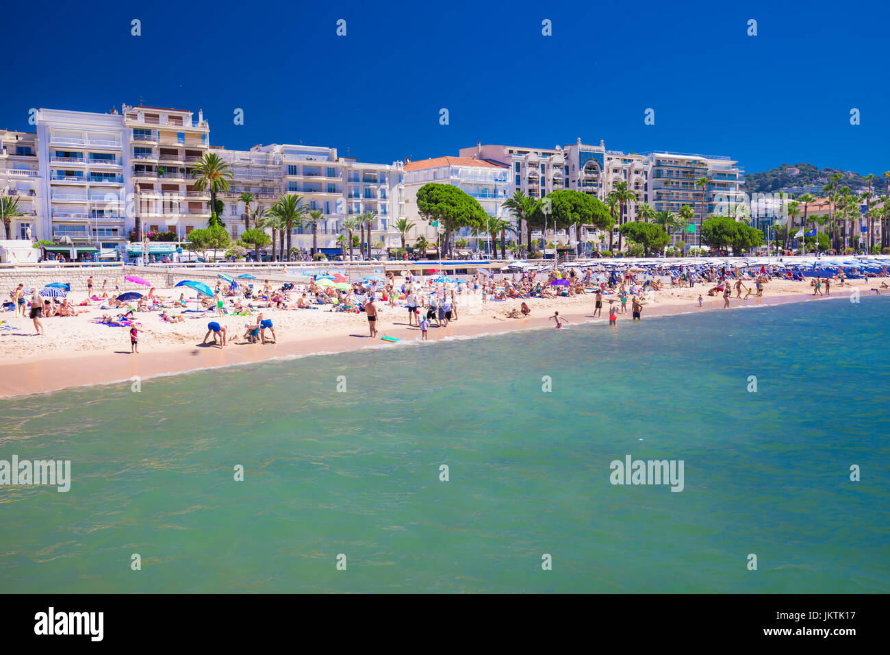 CANNES, FRANCE July 2017 Sandy beach in Cannes city with colorful