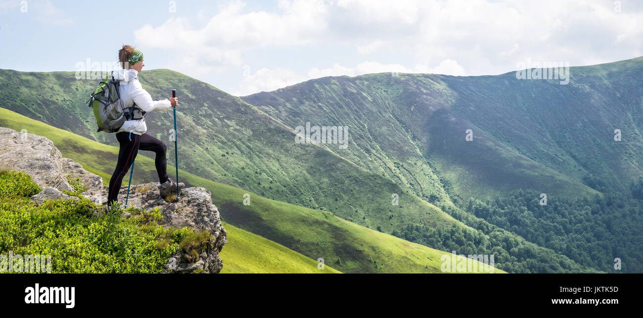 Young woman hiking in the mountains Stock Photo - Alamy