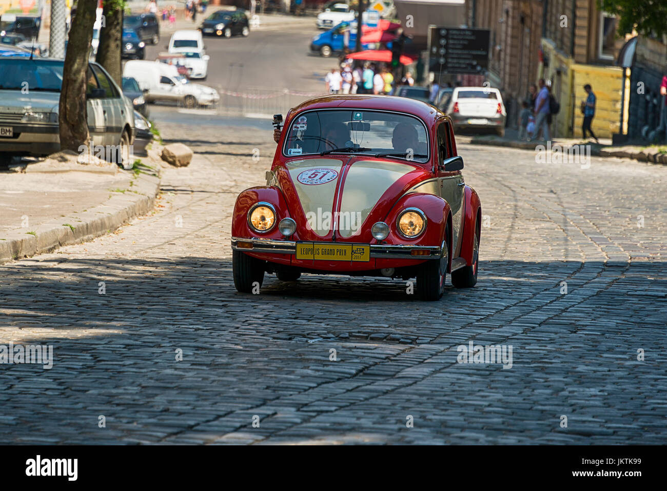 Lviv, Ukraine - June 4, 2017: Old retro car Volkswagen KAFER with its owner and au unknown passenger taking participation in race Leopolis grand prix  Stock Photo