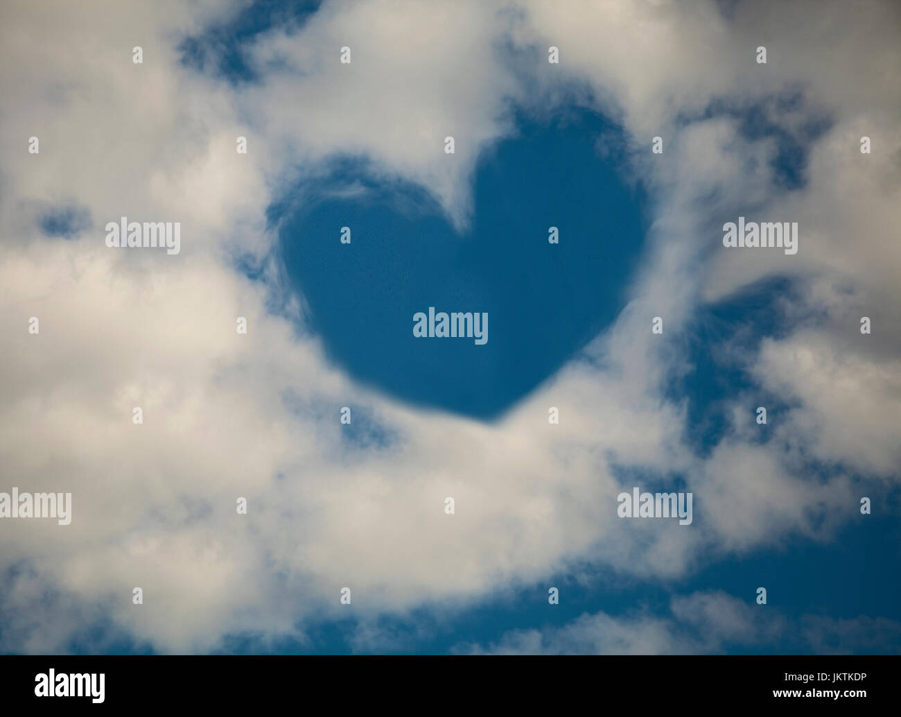 Heart shaped cloud in blue sky Stock Photo - Alamy