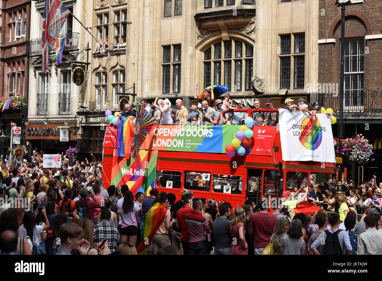 Supporters of the Opening Doors London charity drive on the double-decker red bus through central London at the Pride in London parade, 2017. Stock Photo
