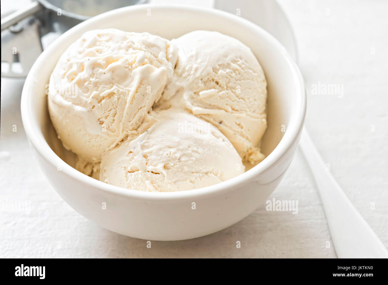 Vanilla ice cream scoops in white bowl Stock Photo Alamy