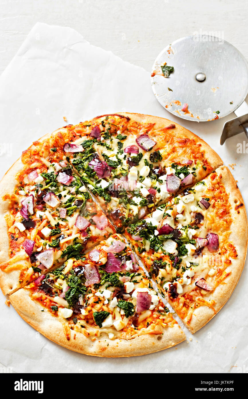 Vegetable and goats cheese pizza on thin base Stock Photo Alamy