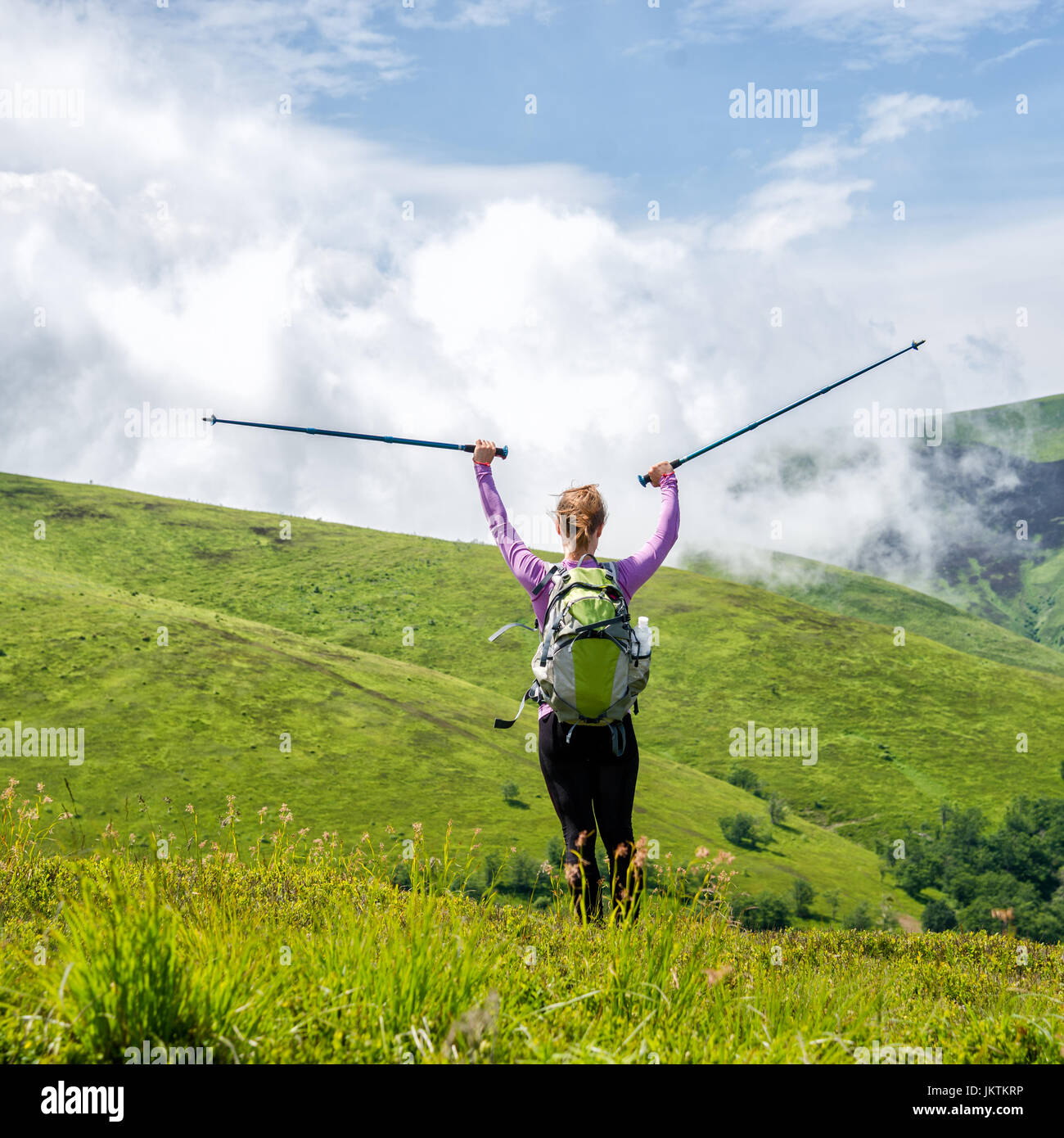 Young woman hiking in the mountains Stock Photo - Alamy