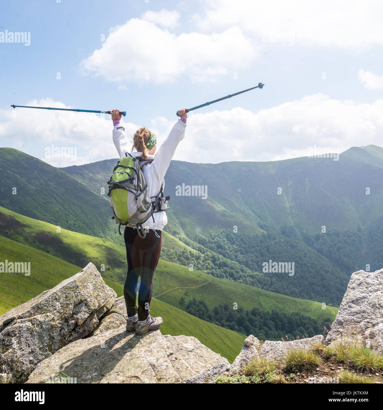 Young woman hiking in the mountains Stock Photo - Alamy