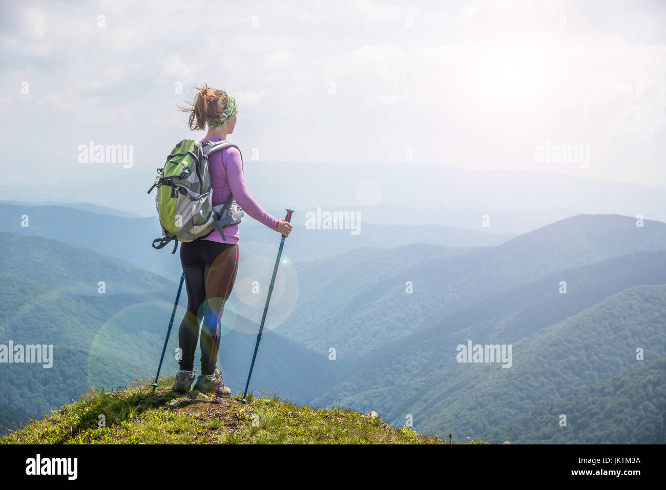 Young woman hiking in the mountains Stock Photo - Alamy