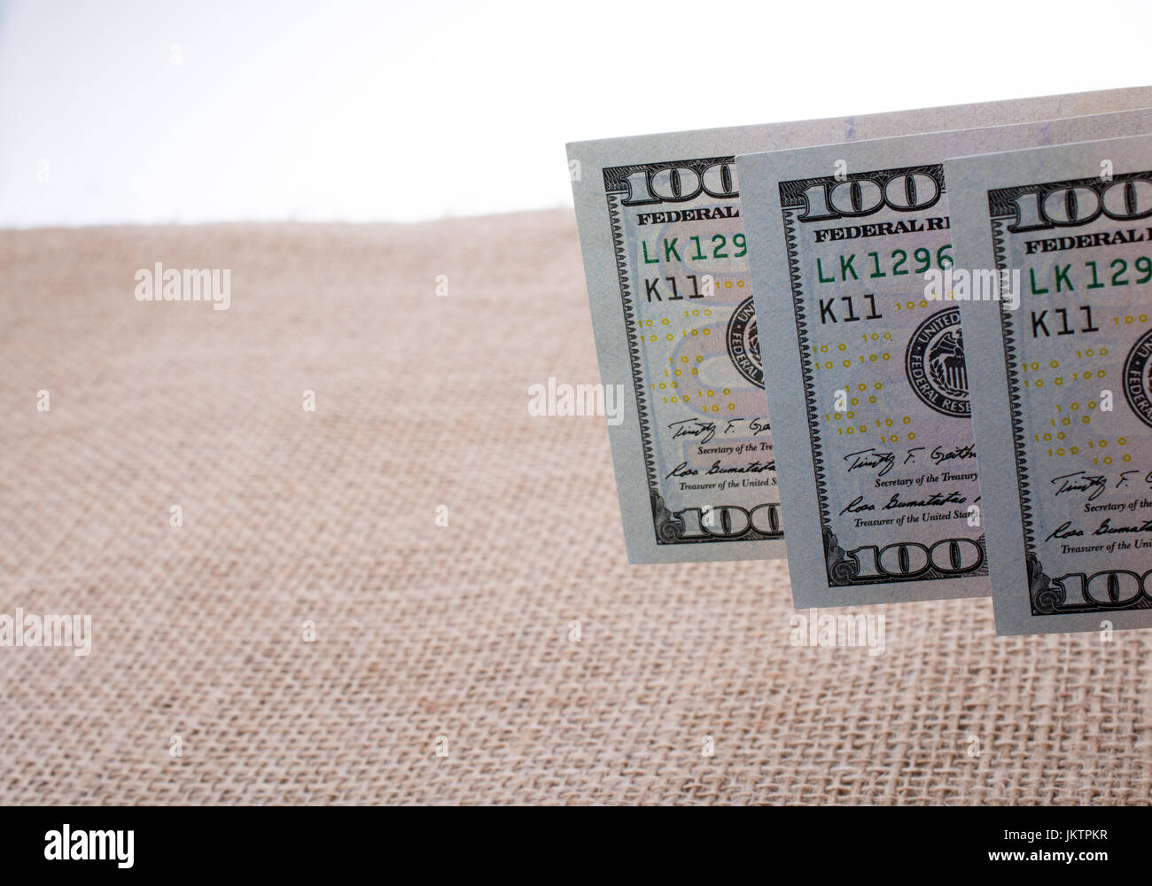 Banknotes of US dollars on canvas on a linen canvas Stock Photo - Alamy