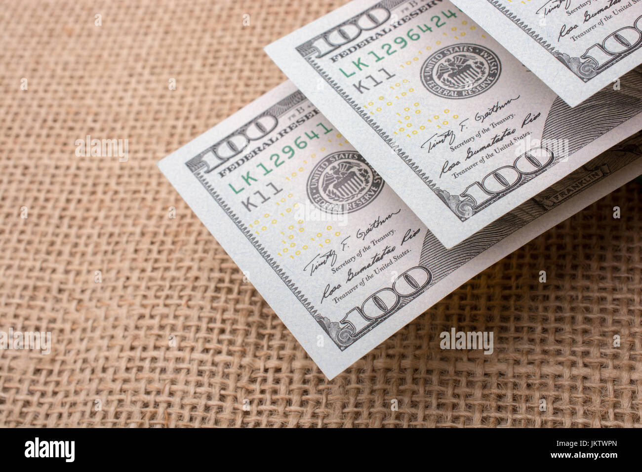 Banknotes of US dollars on canvas on a linen canvas Stock Photo - Alamy